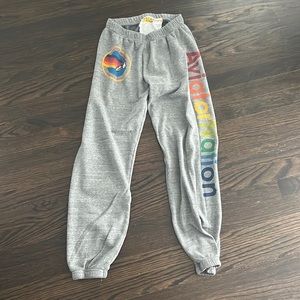 Aviator nation sweatpants in heather grey and rainbow letters.